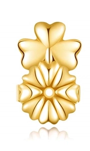 Detailed close-up of golden clover earring lifters with polished metallic finish