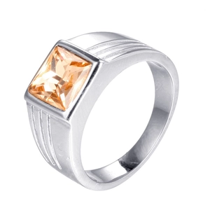 Macro view of men's stainless steel ring with square champagne gemstone and striped design