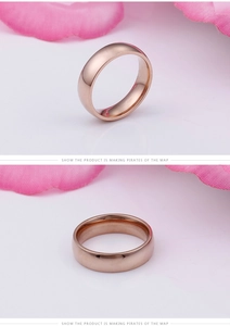 Polished rose gold titanium steel ring shown from side and top views with floral accents