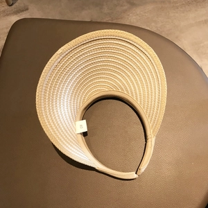 Women's open top straw sun hat with beige stripes and wide brim for beach sun protection