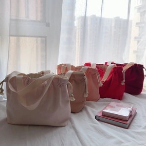 Minimalist canvas drawstring handbags in gradient pink and red tones with cotton handles