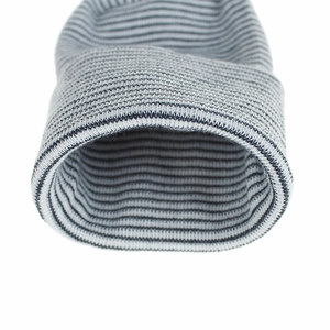 Close-up of double-layer striped knit baby hat cuff showing soft ribbed texture details