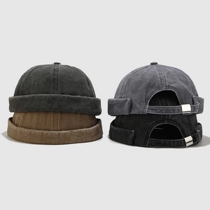 Detail of vintage washed canvas docker hats with adjustable metal buckles in four colors