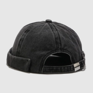 Detail of vintage charcoal denim docker hat featuring a metal adjustment buckle and texture