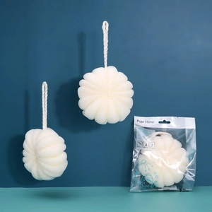 Close-up of white soft mesh bath sponge with hanging rope and branded retail packaging