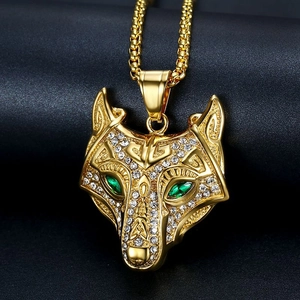Gold Celtic wolf head pendant necklace with clear crystals and green gemstone eyes
