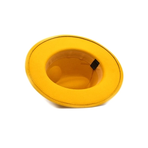 Classic yellow wool felt jazz hat with wide brim shown from a side-down angle perspective