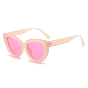 Retro cat-eye sunglasses with peach matte frames and neon pink lenses on white background