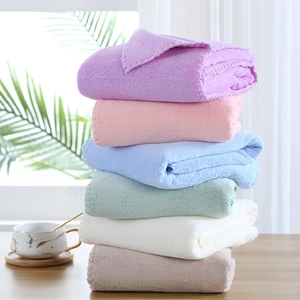 Soft coral fleece towel set with 6 colors stacked in a bright home setting