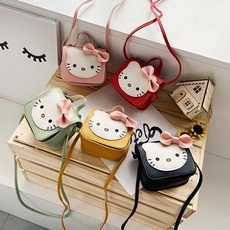 Close-up of Hello Kitty crossbody bags in pink, red, green, yellow and black colors