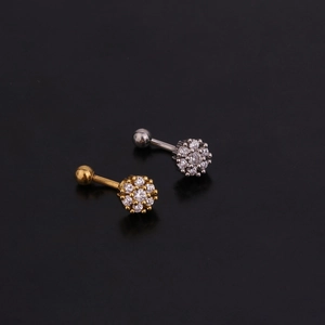 Detailed view of silver and gold zircon flower eyebrow rings with curved steel barbells