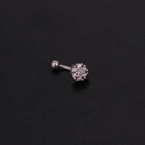 Detailed view of silver stainless steel curved barbell with a clear zircon flower top