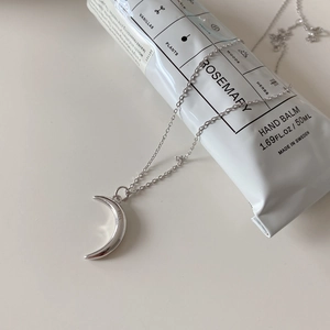 Detail of 925 sterling silver crescent moon pendant necklace with S925 hallmark