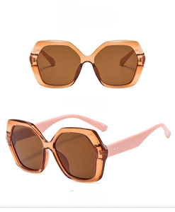 Front and 45-degree views of oversized polygonal sunglasses in light brown and pink