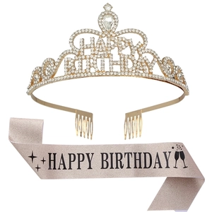 Detail of crystal happy birthday crown and pink fabric sash for party decorations