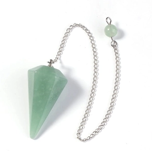 Macro shot of green aventurine hexagonal crystal pendulum pendant with silver chain detail