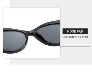 Detail of ergonomic integrated nose pads on black cat-eye sunglasses for comfortable wear