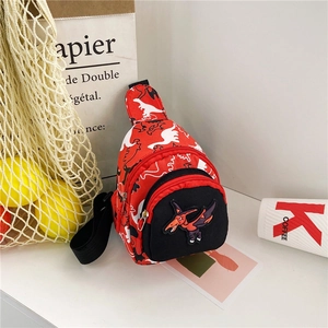 Detail of red dinosaur kid chest bag with cartoon pterosaur patch and black zipper pocket