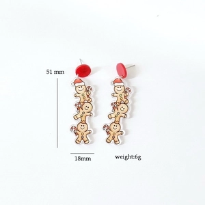 Detailed size view of Christmas gingerbread man earrings showing 51mm by 18mm dimensions