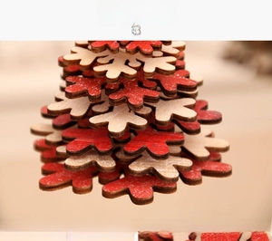 Macro detail of wooden snowflake Christmas ornaments with natural and red painted finish