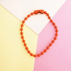 Vibrant orange 2.4mm beaded chain keychain connector on a geometric pastel background