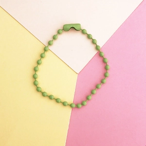 Detail of light green painted ball chain for DIY keychains with metal connector clasp