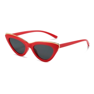 Fashionable red cat eye sunglasses with gold metal trim and dark grey lenses for women