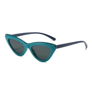 Fashionable cat-eye sunglasses with teal frames and grey lenses shown at a 45-degree angle