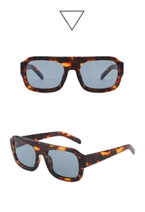 Detailed front and side views of vintage tortie frame sunglasses with blue lenses