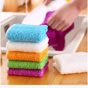 Macro shot of colorful microfiber dishcloths showing texture and water absorption detail