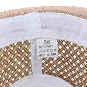 Detailed interior view of a breathable woven straw jazz hat with size 58 paper label