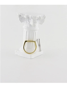 Detail view of irregular 925 silver and gold rings with pavé diamonds on a white column