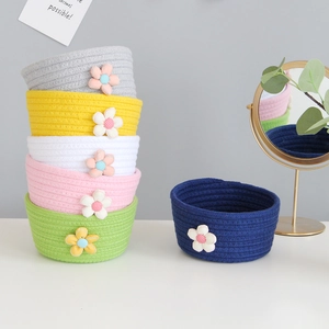 Handcrafted cotton rope storage baskets in multiple colors with floral accents