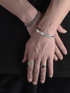 Men's set featuring stainless steel daisy ring, chain ring, and beaded bracelets with cuff