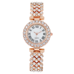 Close-up of rose gold luxury watch featuring crystal-encrusted bezel and Roman numerals