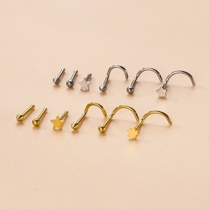 Surgical steel nose studs in gold and silver with star, ball, and cone designs