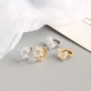 Macro view of S925 sterling silver flower hoop earrings with marquise cubic zirconia