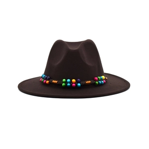 Detail of coffee wool fedora hat featuring a colorful beaded decorative band and felt texture