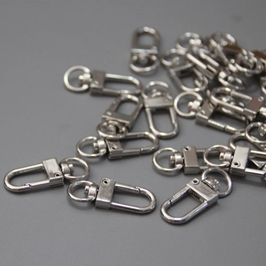 Close-up of polished silver swivel snap hooks for bags and DIY keychains hardware
