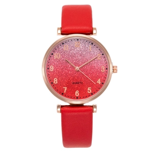 Detail of red leather strap watch with rose gold case and glitter gradient dial