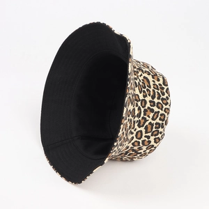 Detail of leopard print bucket hat showing wide brim and dual-layer canvas texture