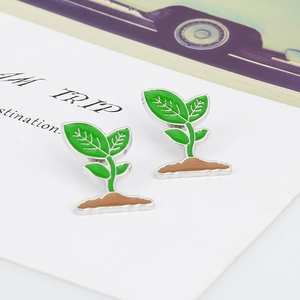 Pair of creative green sprout enamel plant brooches with silver trim in nature design