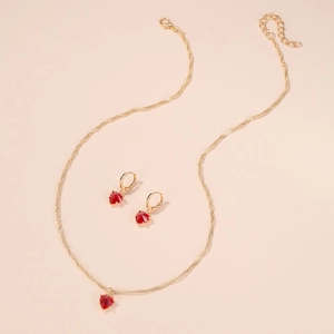 Parure de bijoux dorés avec pendentif cœur en cristal rouge et boucles d'oreilles assorties