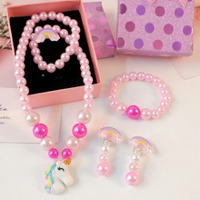 Kids jewelry set with pink unicorn necklace, bracelet, earrings and ring in a gift box