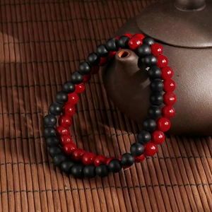 Vintage turquoise matte agate beaded bracelet set on ceramic teapot in zen style