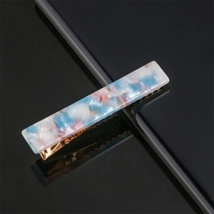 Acetate rectangle hair clip detail, blue pink marble pattern bobby pin with gold metal base.