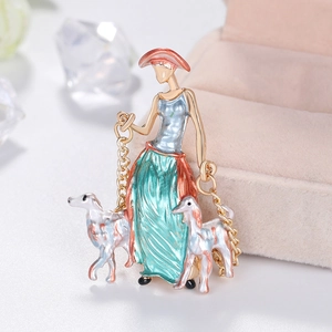Elegant enamel brooch featuring a lady walking two dogs, artistic fashion accessory