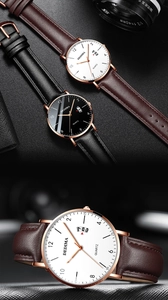 Detail view of ultra-thin quartz watch with leather strap and calendar display window