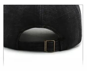 Detail of vintage washed cotton baseball cap with adjustable bronze metal buckle back