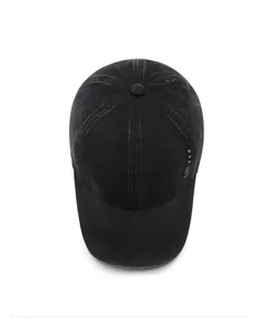 Top view of washed black cotton baseball cap with DST embroidery and metal rivet details
